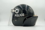 Police helmet with metraquilate cap